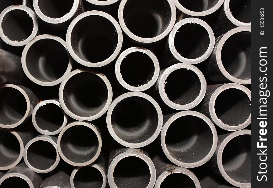 Plastic Drainage Pipes are Stacked for Sale. Plastic Drainage Pipes are Stacked for Sale