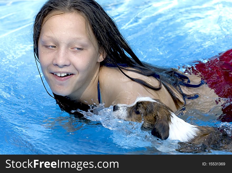 Girl Swimming With Her Dog