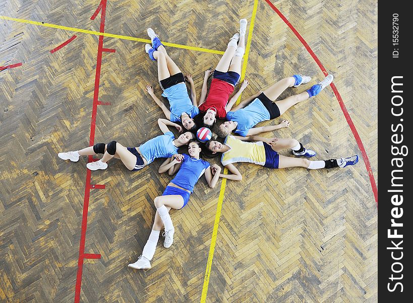 Volleyball game sport with group of young beautiful  girls indoor in sport arena. Volleyball game sport with group of young beautiful  girls indoor in sport arena