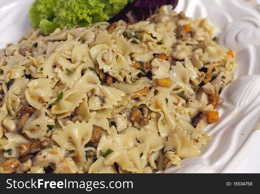 Pasta - Farfalle  with Chanterelle Herb and Olive Oil on Plate Full Frame. Pasta - Farfalle  with Chanterelle Herb and Olive Oil on Plate Full Frame