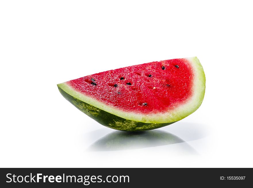 Slice of fresh juisy watermelon isolated on white background with reflection