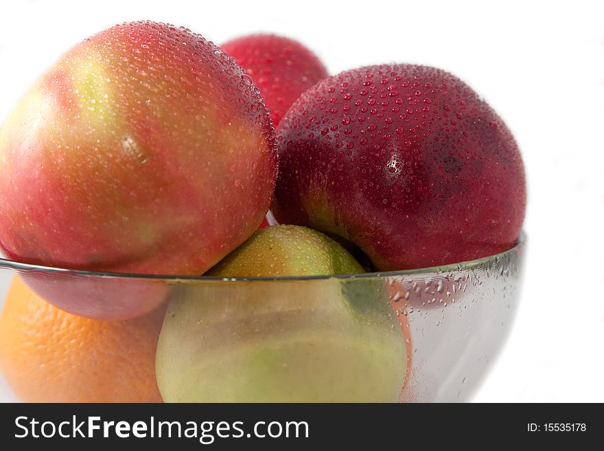 Apples in a glass vase. Isolated, white background