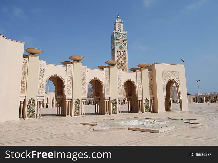 A row of arches in the vast courtyard in front of the mosque of Hassan II in Casablanca. A row of arches in the vast courtyard in front of the mosque of Hassan II in Casablanca