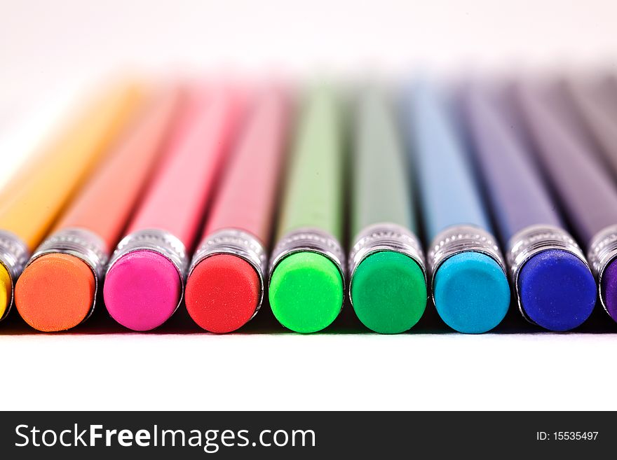 A Row of Colourful Erasers on the ends of pencils