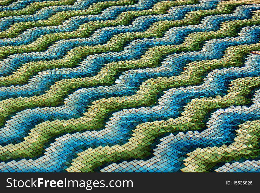 Underwater mosaic in the garden waterfall