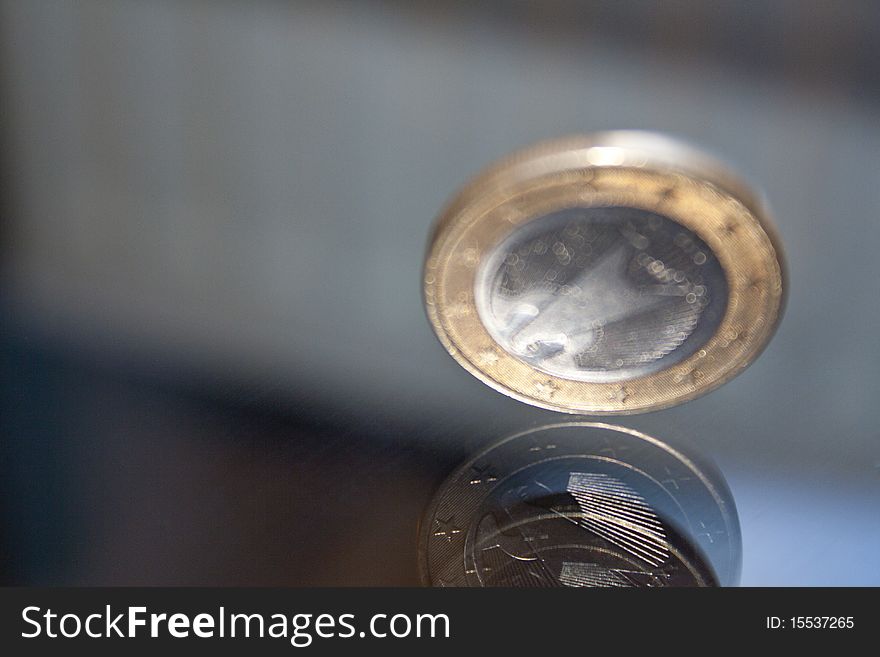 Money, One Euro Coin with reflection