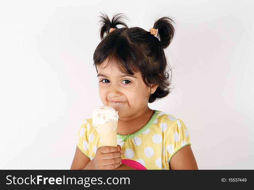 Sweet and cute toddler eating and enjoying ice cream. Sweet and cute toddler eating and enjoying ice cream