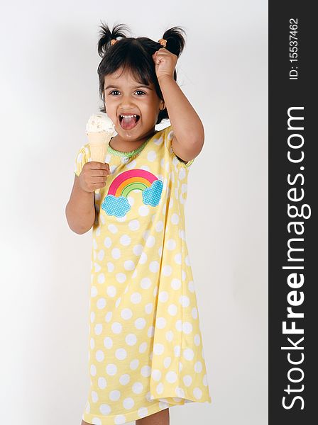 Sweet and cute toddler eating and enjoying ice cream. Sweet and cute toddler eating and enjoying ice cream