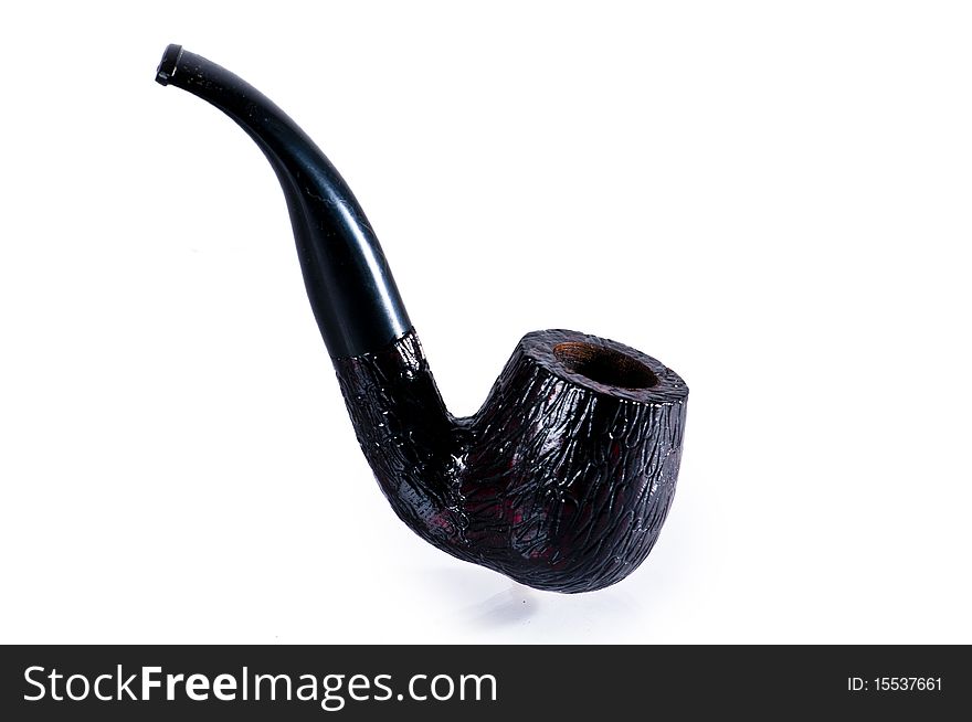 Old black stylish tobacco pipe isolated on white background