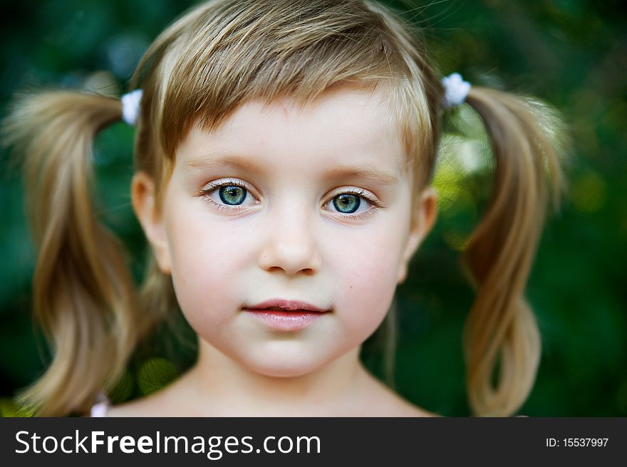 Portrait of a happy liitle girl close-up. Portrait of a happy liitle girl close-up