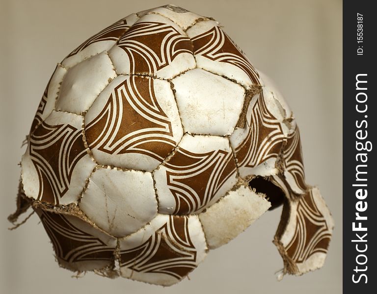 The broken off ball on a neutral background. The broken off ball on a neutral background