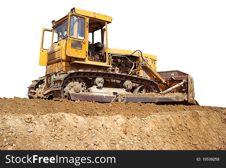 Isolated on white bulldozer. Logos and trademarks have been removed. Men working are unrecognizable. Bright sunny  day.