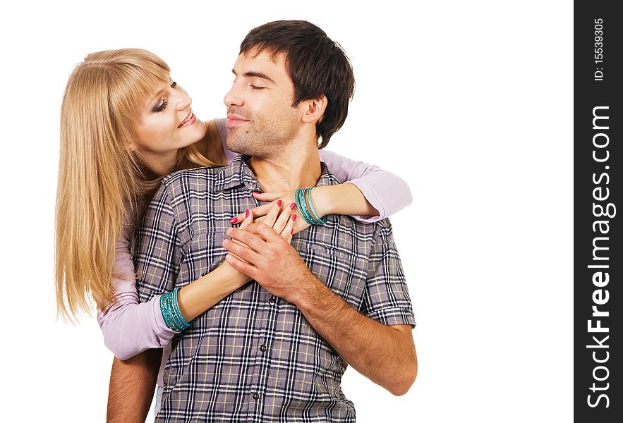 Romantic young couple in casual clothing, white background. Romantic young couple in casual clothing, white background