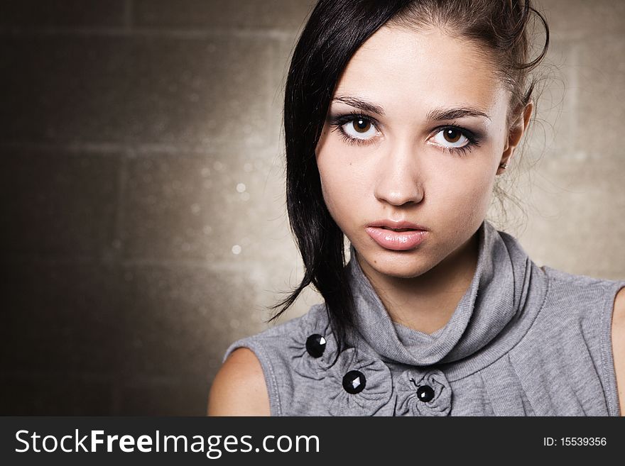 Studio portrait of a beautiful fashionable model. Studio portrait of a beautiful fashionable model