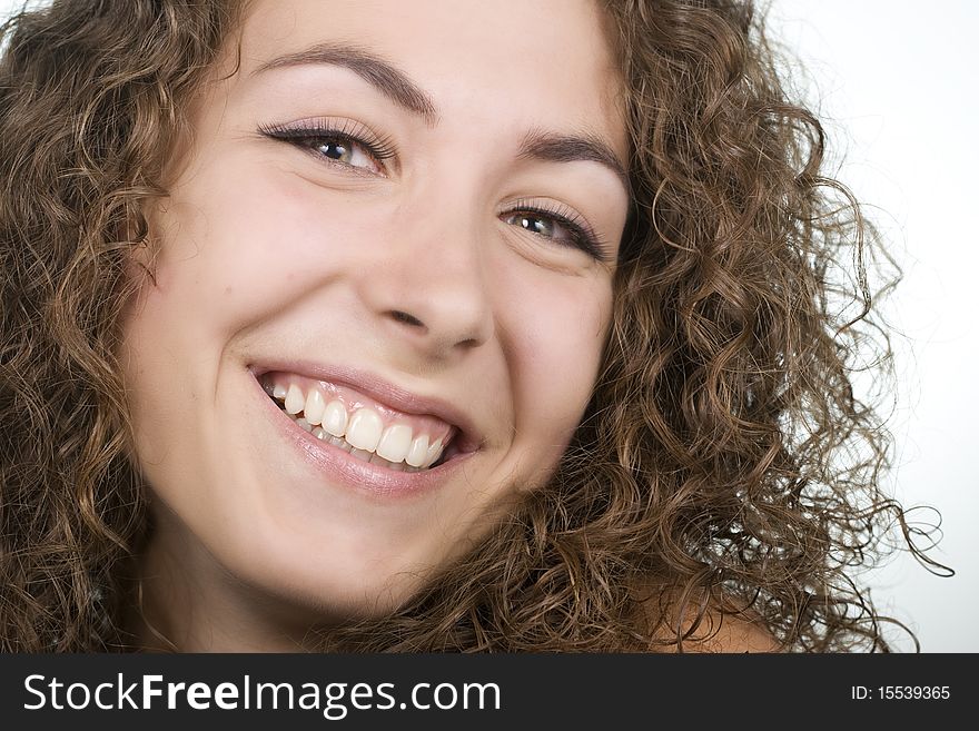 Beautiful young curly cheerful girl laughing. Beautiful young curly cheerful girl laughing