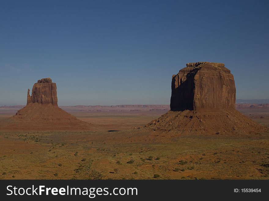 Desert Sand And Rock Formations At Monument Valley In The Navajo Tribal Park, Northeastern Arizona, USA