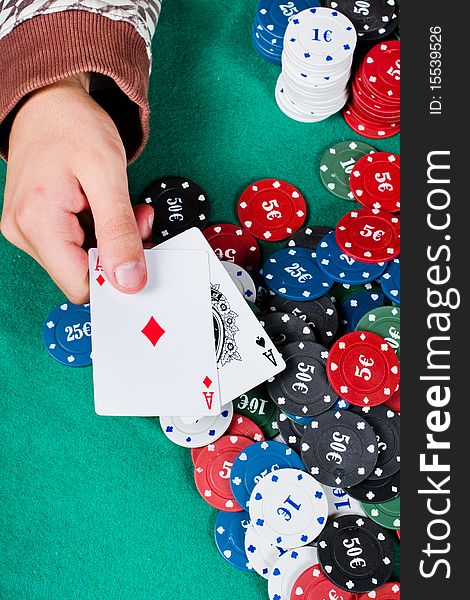 Player shows Two ace cards hand and chips. Player shows Two ace cards hand and chips