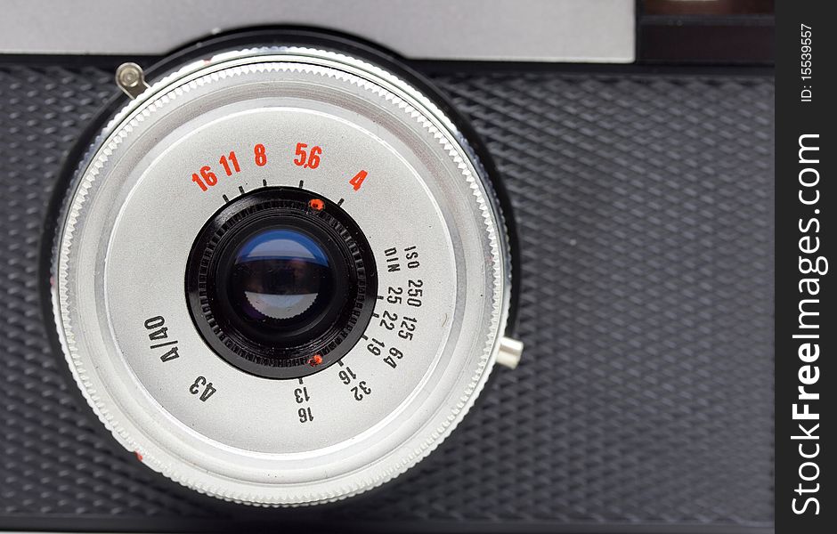 Close-up of an old 35mm film camera lens. Close-up of an old 35mm film camera lens.