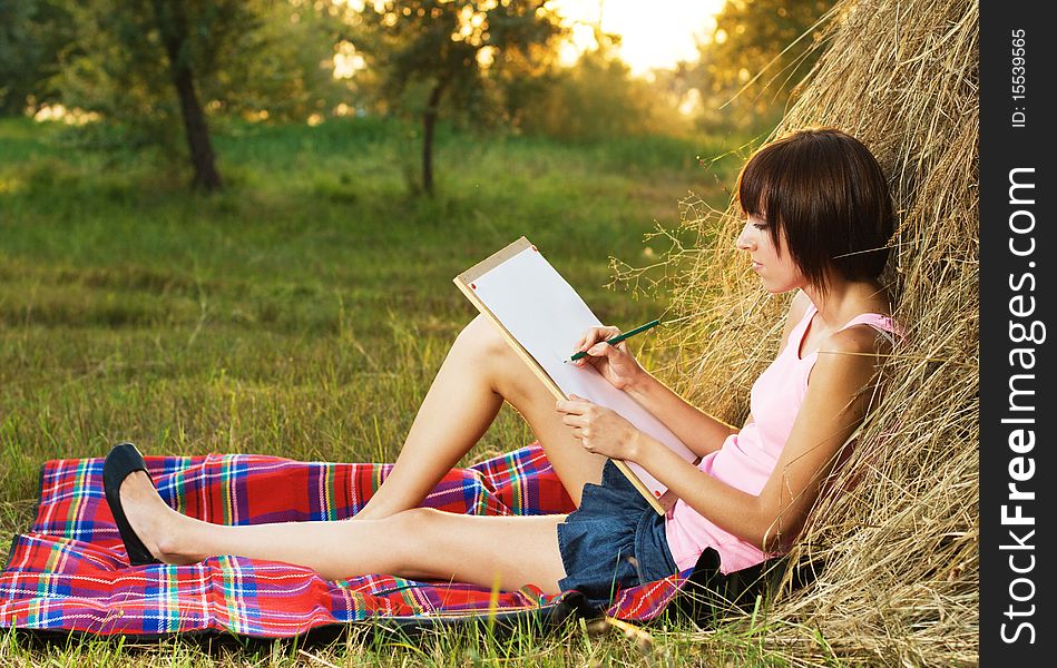 Lovely Girl Drawing In The Park