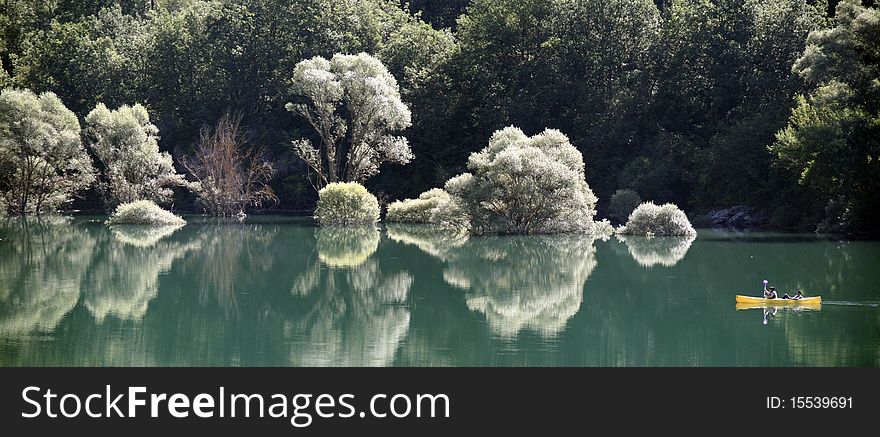 Calmed water and special sunlight over the trees turns this place in small paradise. Calmed water and special sunlight over the trees turns this place in small paradise.