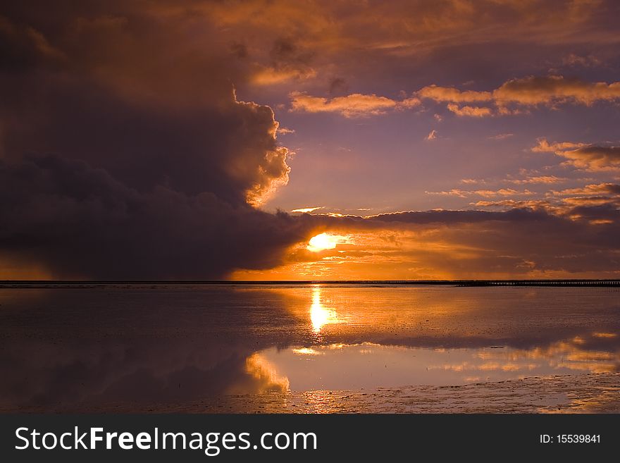 Cloudy Sunset Over The Ocean