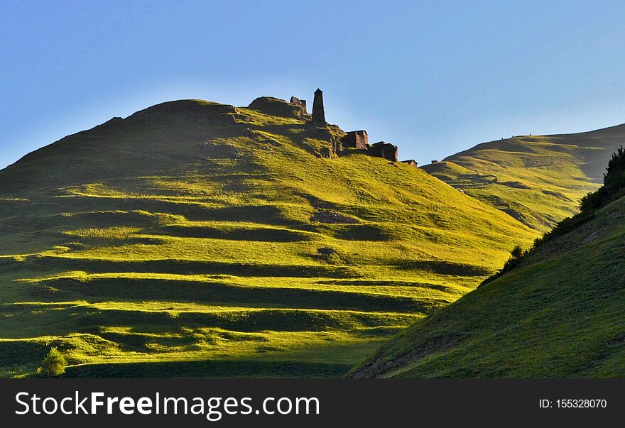 Trek from Omalo to Shatili through Atsunta Pass, Georgia. Beautiful old city, fortress, green hills.