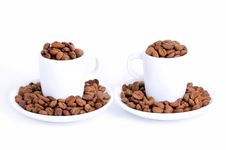 Two Coffee Cups Filled With Coffee Beans Stock Photos Two Coffee Cups Filled With Coffee Beans Stock Photos