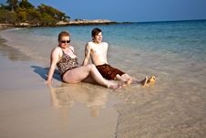 Mother And Son Sitting At A Beautiful Sandy Beach Stock Photos Mother And Son Sitting At A Beautiful Sandy Beach Stock Photos