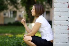 Girl Blows On A Dandelion Royalty Free Stock Images