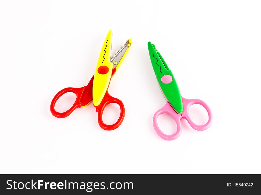 Couple of Toy Scissor, colorful toy, with zigzag and sine curve pattern when cutting at a paper