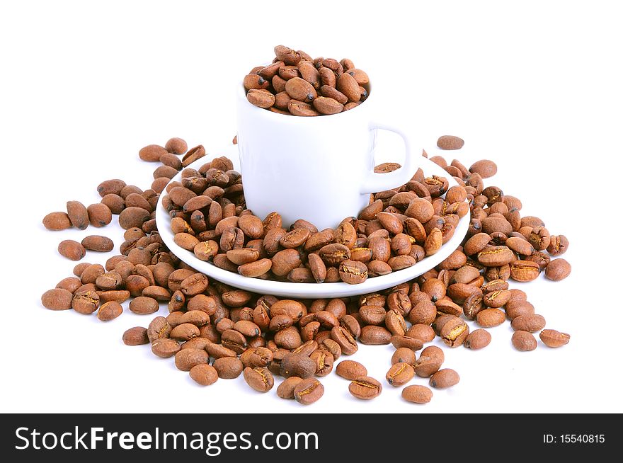 Coffee cup filled with coffee beans isolated