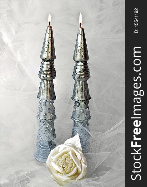 Silver Candles With Netting And Rose