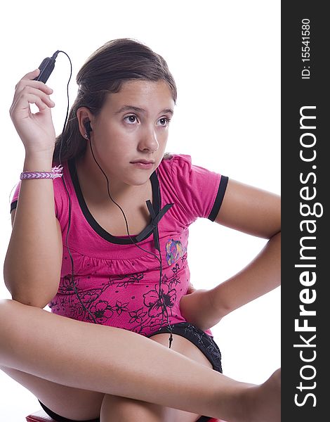 Young girl enjoying music over the headphones. Young girl enjoying music over the headphones