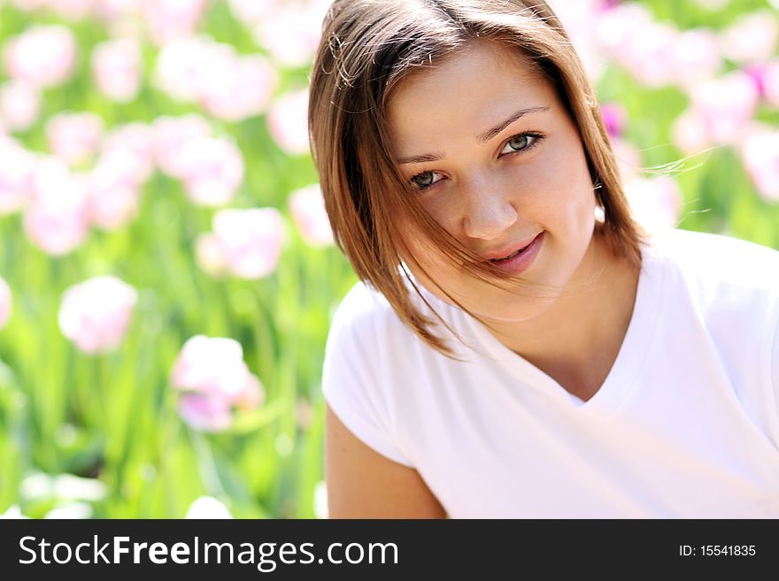 Portrait of beautiful girl with tulip flowers