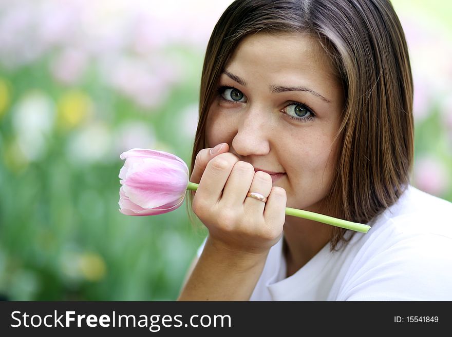 Portrait of beautiful girl with tulip flowers
