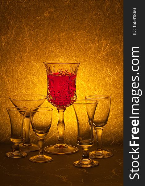 Red wine in glass on background