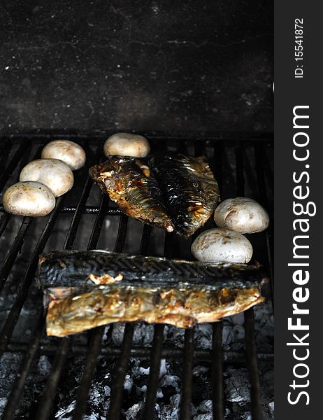 Fish and mushrooms on the barbecue. Fish and mushrooms on the barbecue