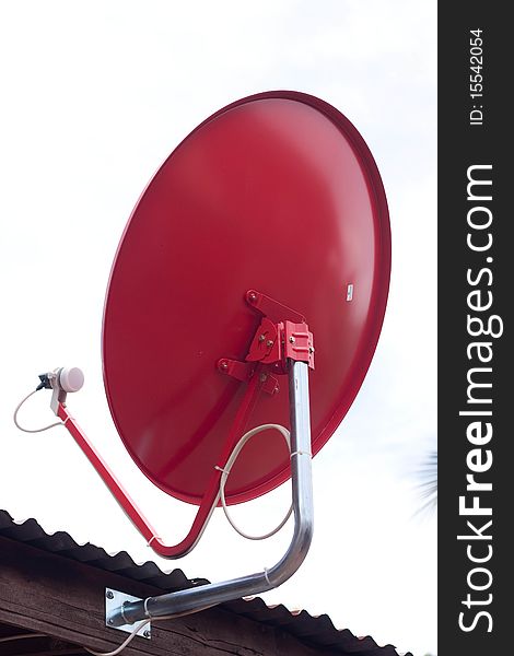 Red satellite dish on the roof