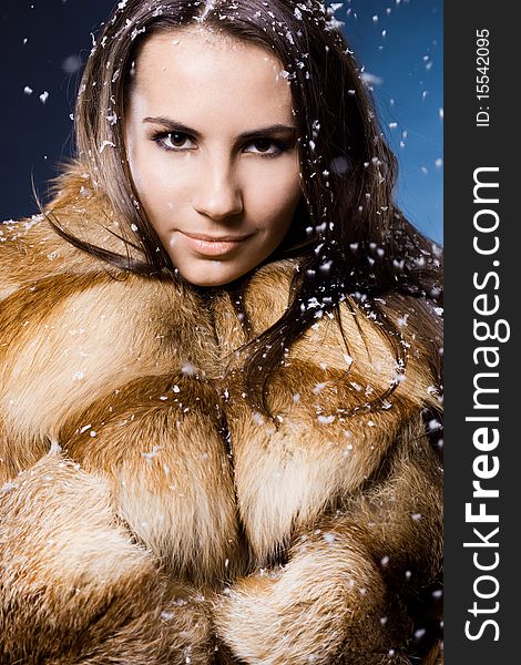 Beautiful woman in a fur coat