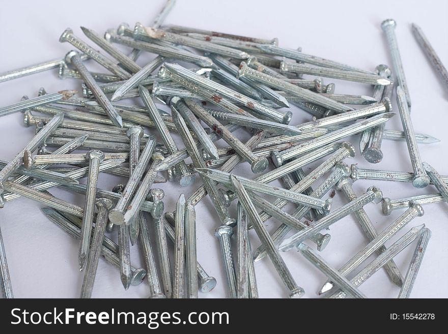 Many nails on white background