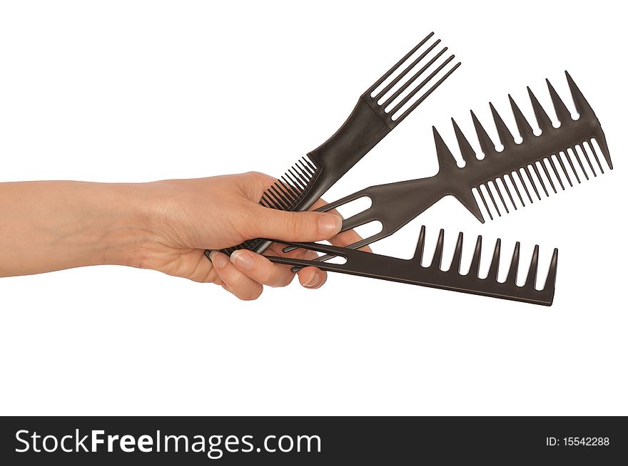 Hairdresser holds the black tools for haircut