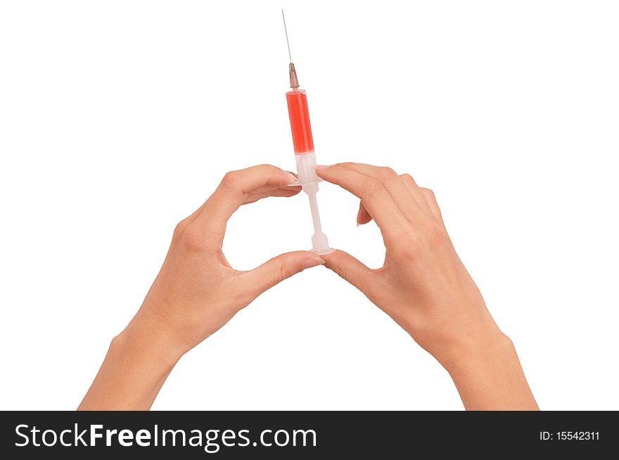 Woman holds in the hand syringe with a new red color antibiotic. Woman holds in the hand syringe with a new red color antibiotic