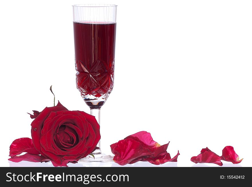 A glass of champagne with red rose on the party