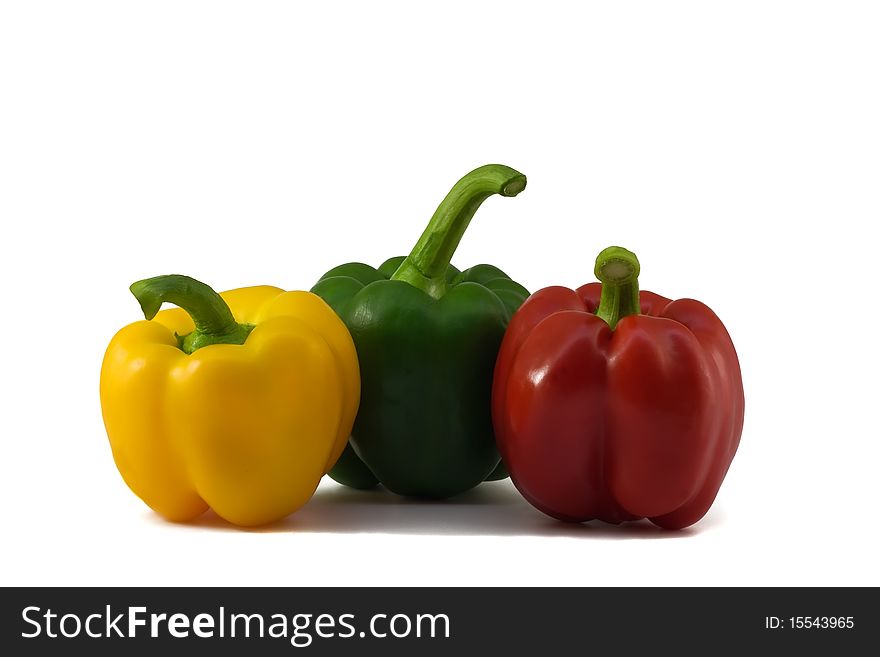 Three fresh peppers: yellow, green, red isolated on white background. Three fresh peppers: yellow, green, red isolated on white background