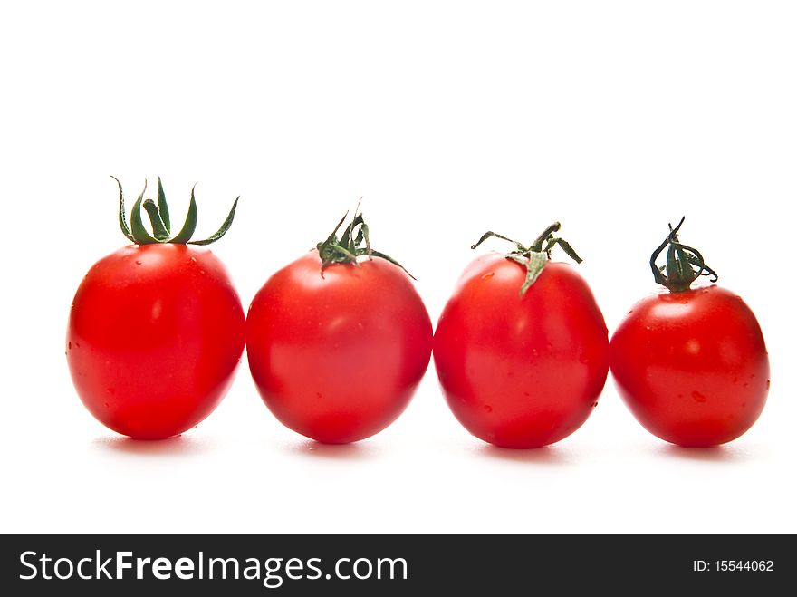 Row from fresh tomatoes isolated on white background. Row from fresh tomatoes isolated on white background
