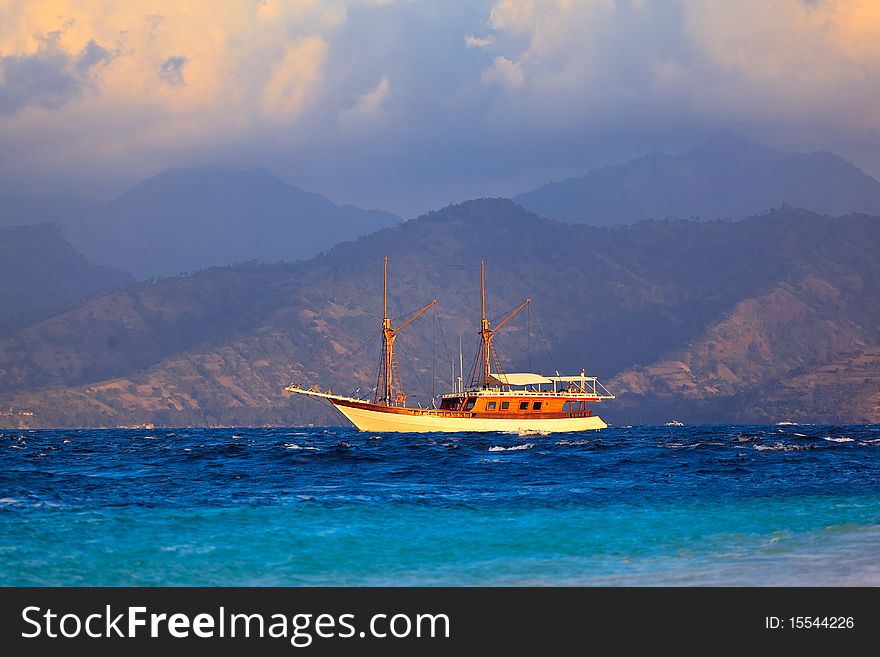 Vintage Frigate sailing on sunset