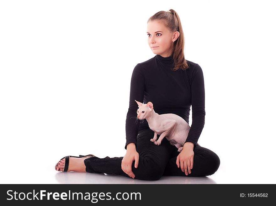 Beautiful young woman with a cat on a white background