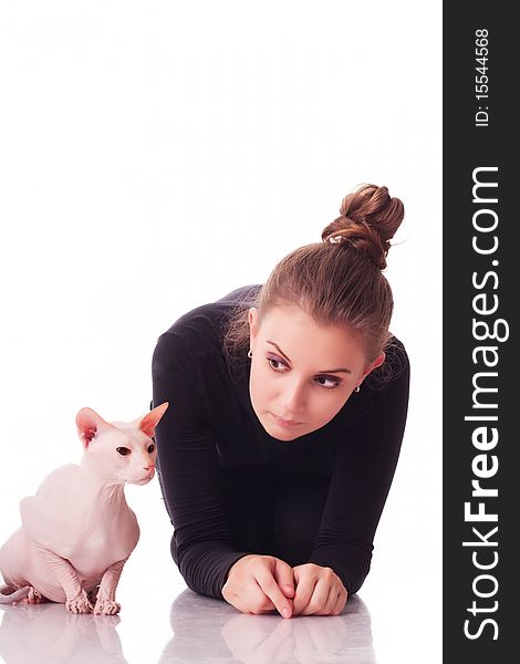 Beautiful young woman with a cat on a white background