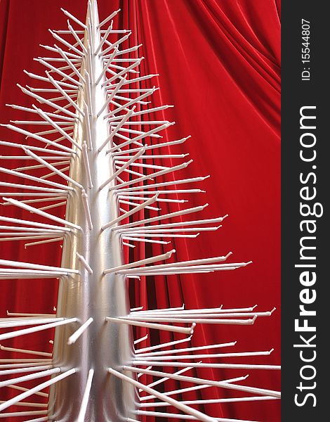 Modern metallic christmas tree with branches-shoelaces