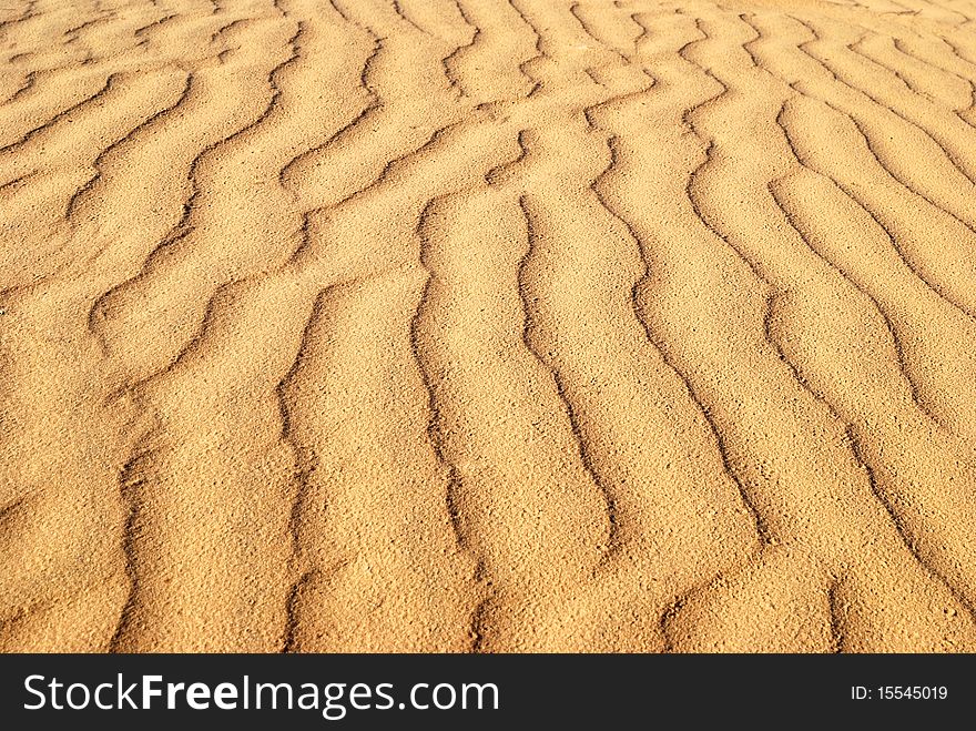 Wavelike ripples of sand, can use for background. Wavelike ripples of sand, can use for background.